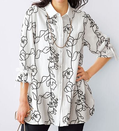 BELLUNA（ベルーナ）の「グラフィック風刺しゅう袖リボンチュニック（チュニック）」